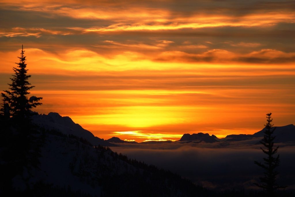 Sunset over snowy mountains.