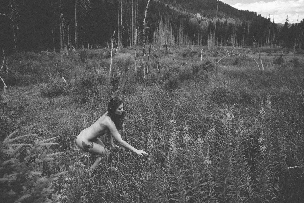 Nude woman in the forest. Black and white photograph by Kyle Graham Photography.
