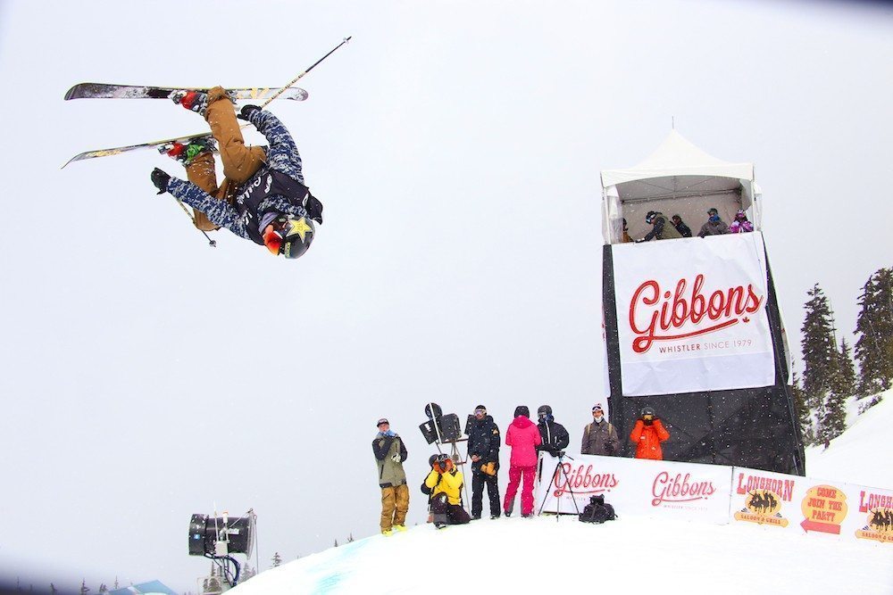 Skier performing an aerial trick at the WSSF Big Air competition, sponsored by Gibbons.
