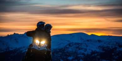Snowmobiling at sunset.