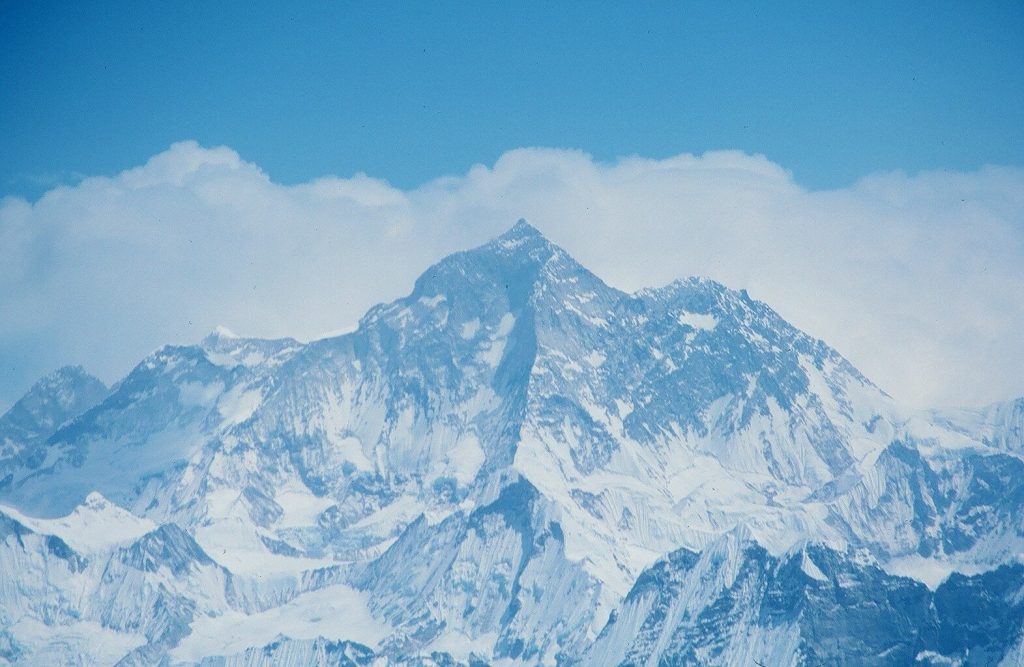 The snow-capped summit of Mount Everest, the top of the world.
