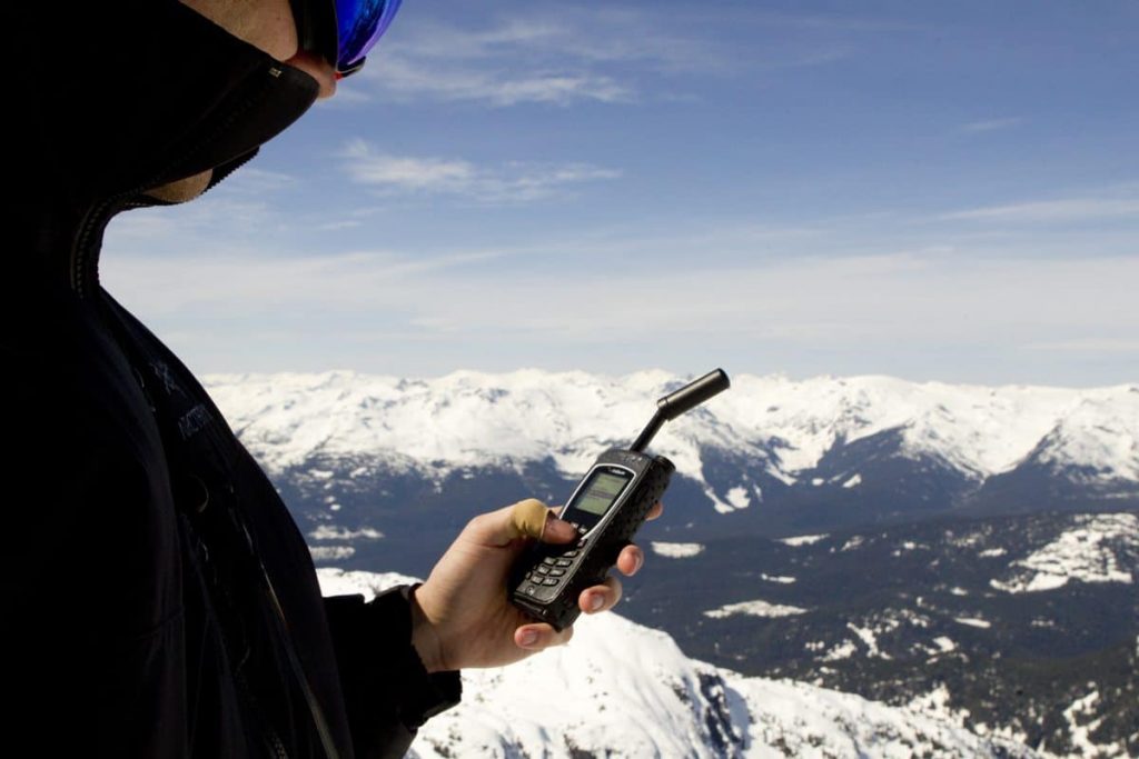 The Iridium Extreme satellite phone in use in the mountains.