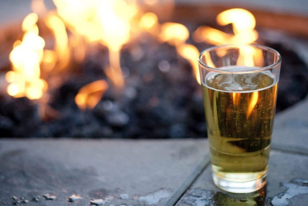 A drink by the fire pit is a cozy activity in Whistler in winter for non-skiers.