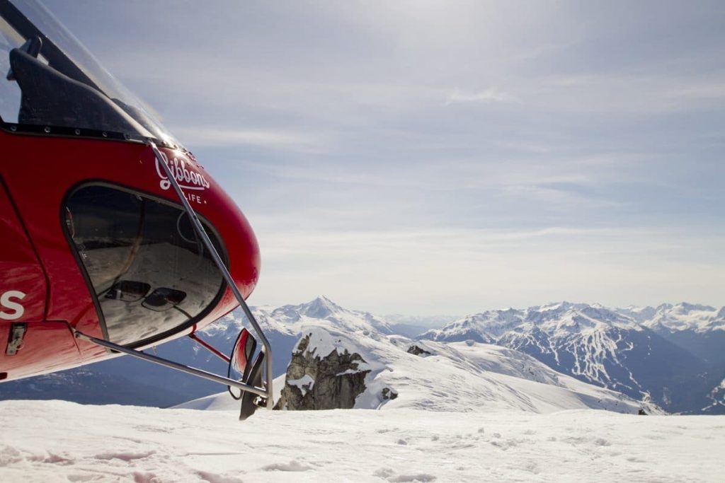 Gibbons Life helicopter on a snow covered mountain in Whistler.