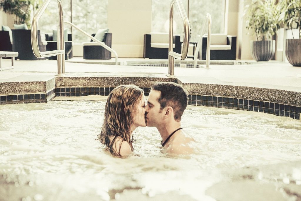 Couple getting cozy in the hot tub.
