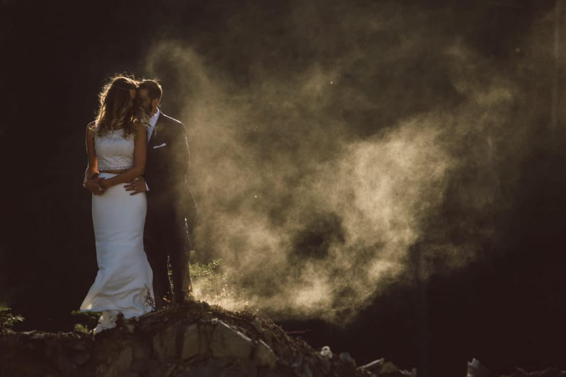 Light filters through the dust to shine on the happy couple.
